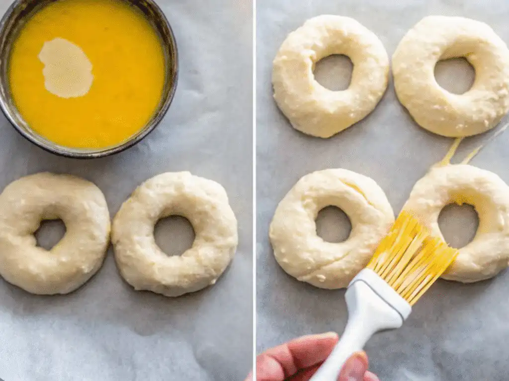 Brushing egg wash over shaped cottage cheese bagels