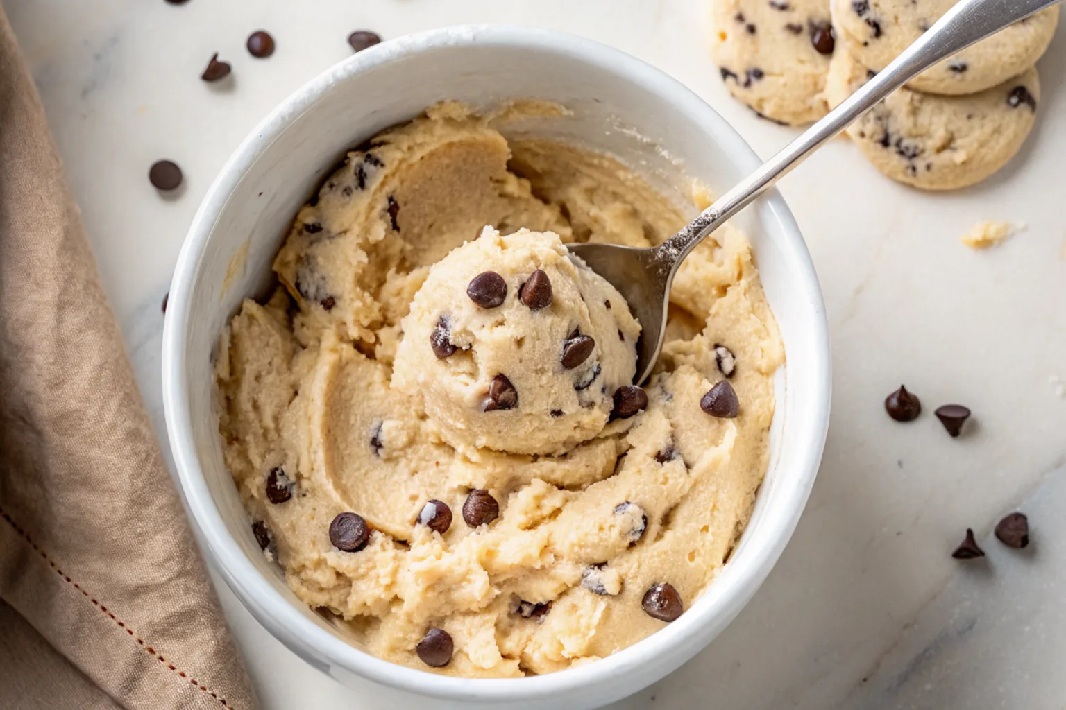 cottage-cheese-cookie-dough-serving Scooped edible cookie dough from white bowl