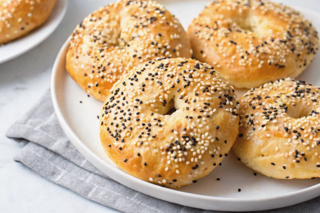 Plated high protein bagels with sesame and poppy seeds
