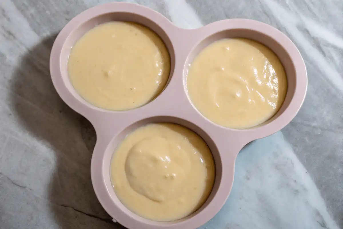 Vanilla cake batter in pink silicone mold