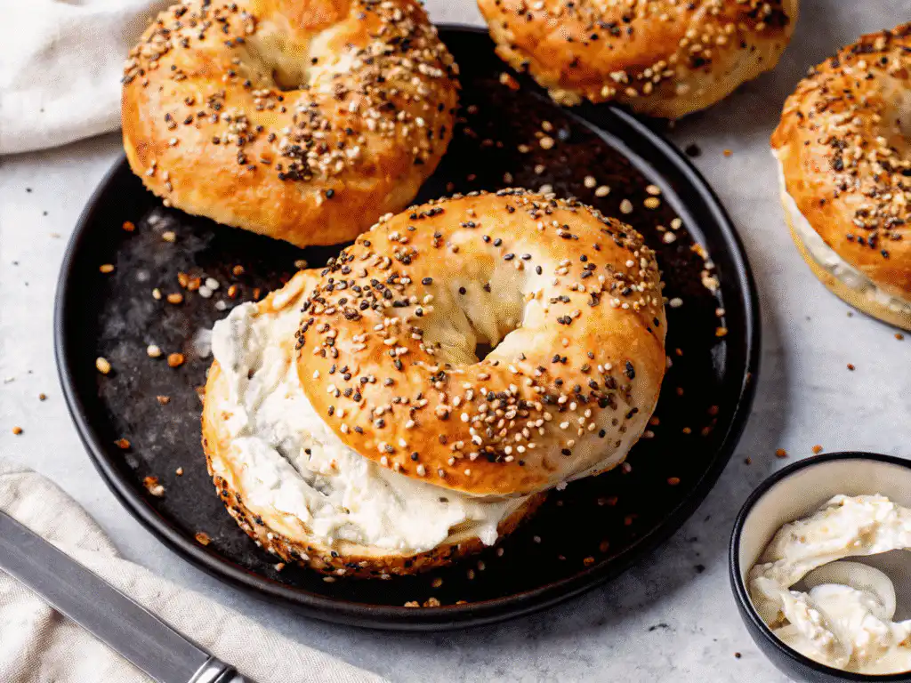 Cottage cheese bagel sliced and served with cream cheese