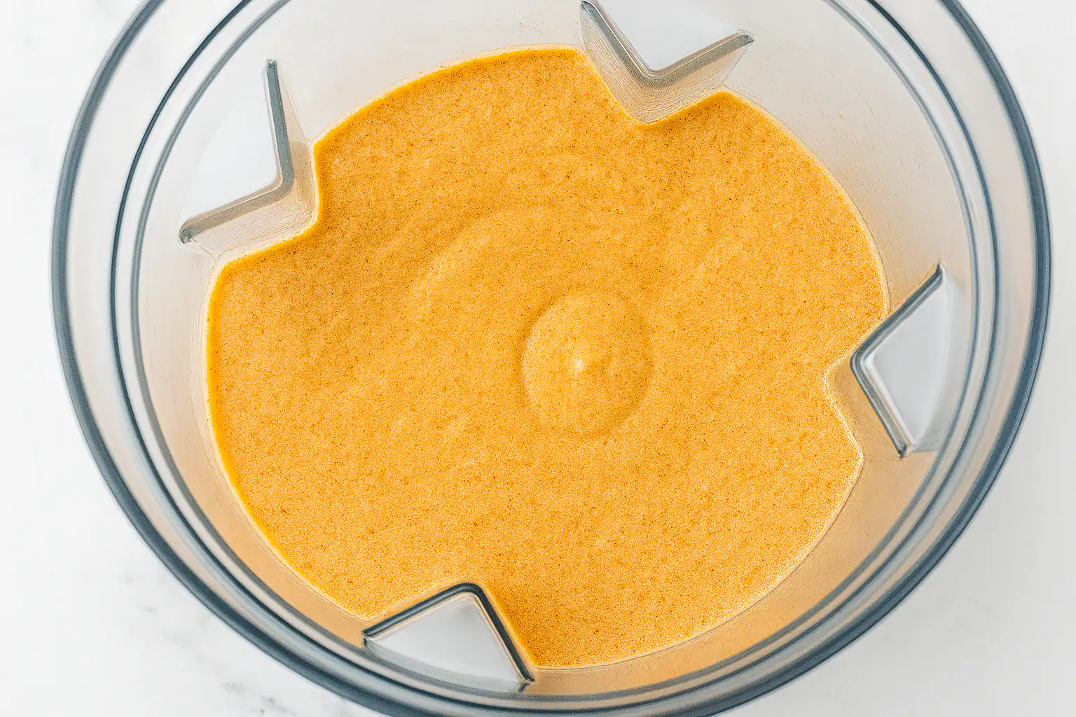 Smooth blended cottage cheese queso in a blender