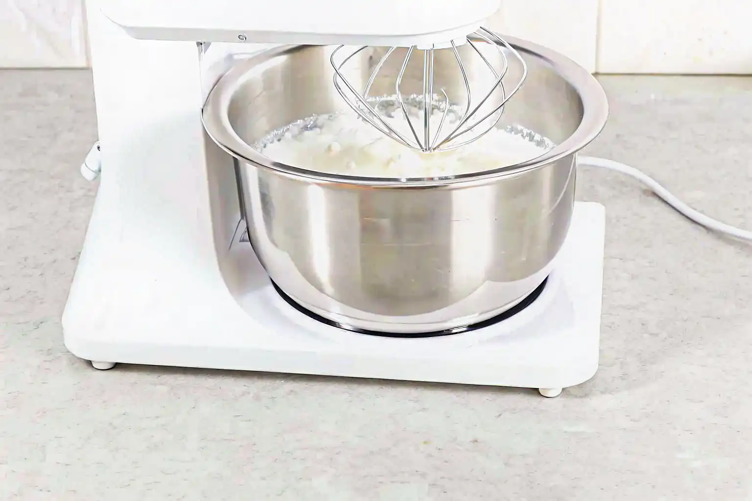 Folding egg whites into yolk mixture for cloud cake