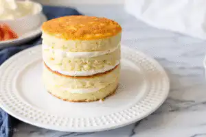 Three layers of cake stacked with frosting