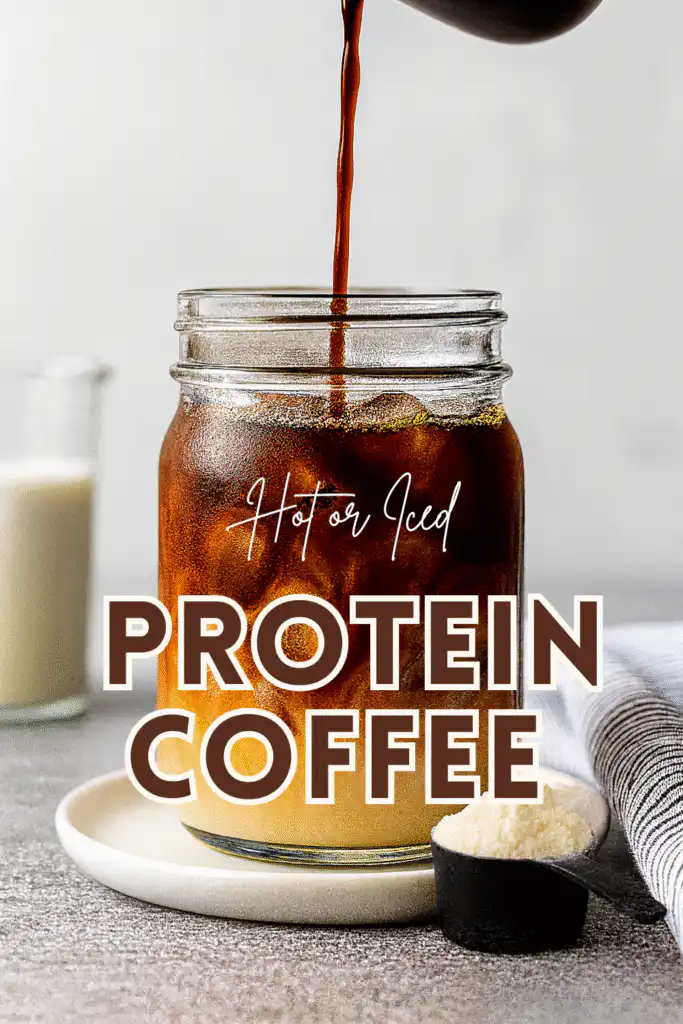 A clear glass filled with iced protein coffee as hot espresso is being poured in, with a scoop of protein powder beside the glass and text overlay reading “Hot or Iced Protein Coffee.”