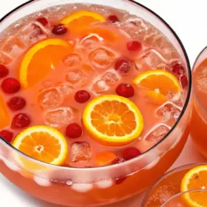 Shirley Temple Punch Recipe Shirley Temple Punch Bright Shirley Temple punch in a glass punch bowl with ice, orange slices, and maraschino cherries a fizzy non-alcoholic party drink.
