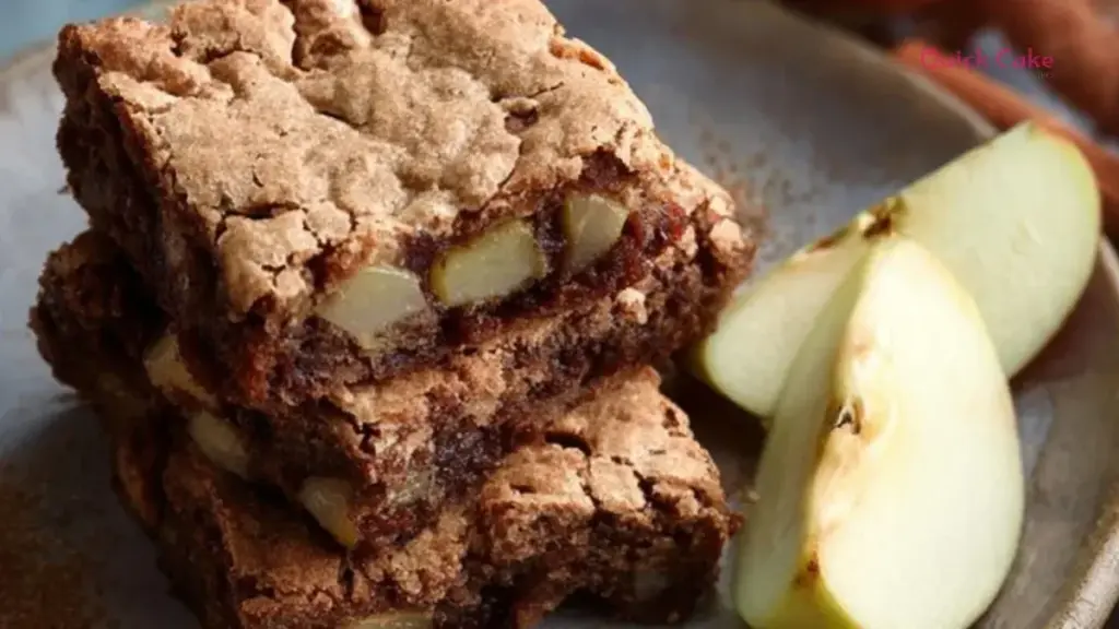 Delicious apple brownies topped with chocolate glaze and served in a dish