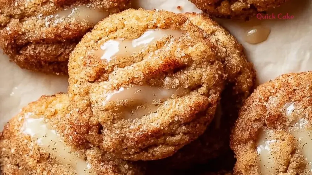 Freshly baked apple cider cookies arranged on a rustic wooden table