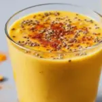 Anti-inflammatory pineapple banana turmeric smoothie in a glass