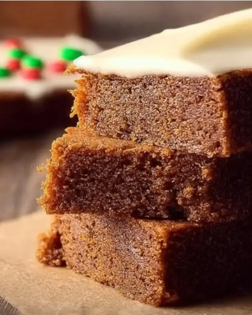Delicious Gingerbread Cookie Bars topped with icing and spices.