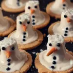 Melted Snowman Cookies decorated with frosting and chocolate for winter treats