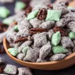 Bowl of Mint Chocolate Puppy Chow snack mix with mint and chocolate flavors