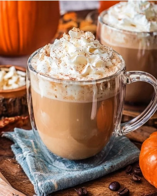 Delicious Pumpkin Spice Hot Chocolate topped with whipped cream and spices