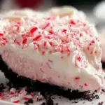 Quick Christmas Peppermint Pie topped with whipped cream and peppermint