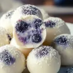 Delicious white chocolate blueberry truffles arranged on a plate
