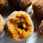 Delicious gluten-free baked pumpkin donut holes served in a decorative bowl