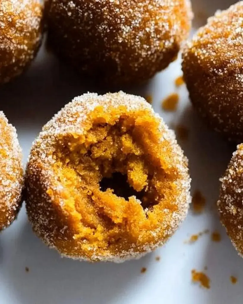 Delicious gluten-free baked pumpkin donut holes served in a decorative bowl