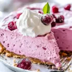 Deliciously creamy Cranberry Mousse Pie garnished with fresh cranberries