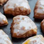 Plate of glazed orange cookies with cinnamon and cloves